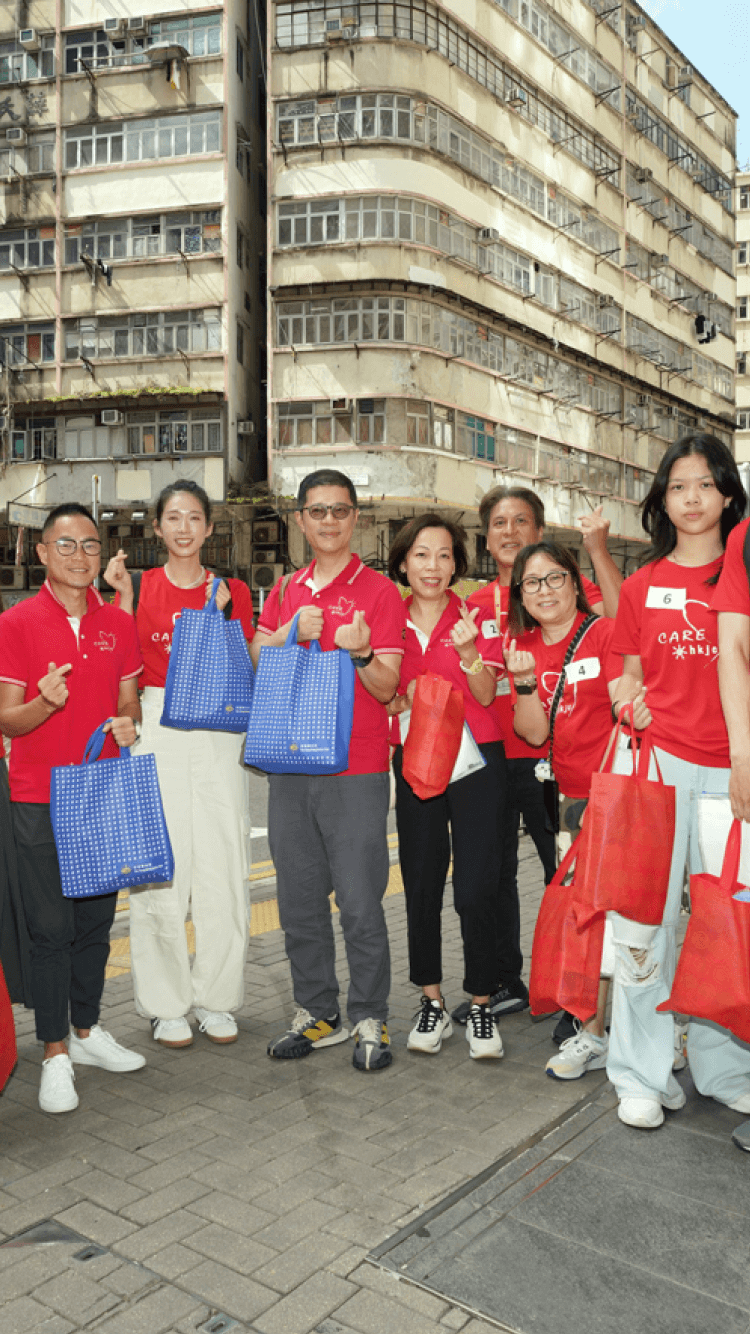 caritas mid autumn holding goodie bag group photo close up outdoor shot