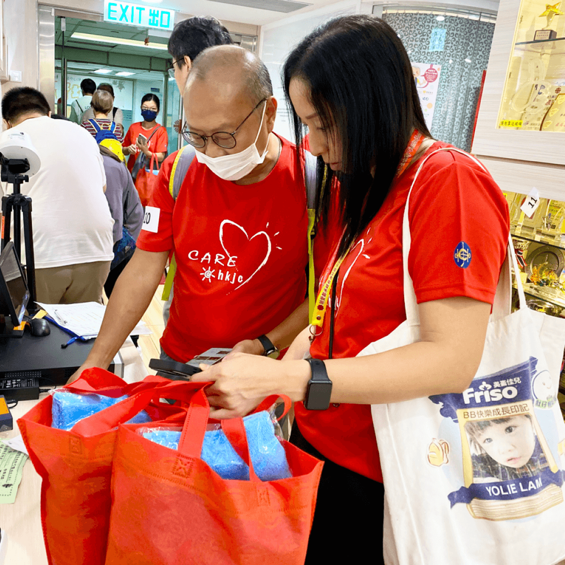 volunteer looking at the caritas mid autumn goodie bag close up