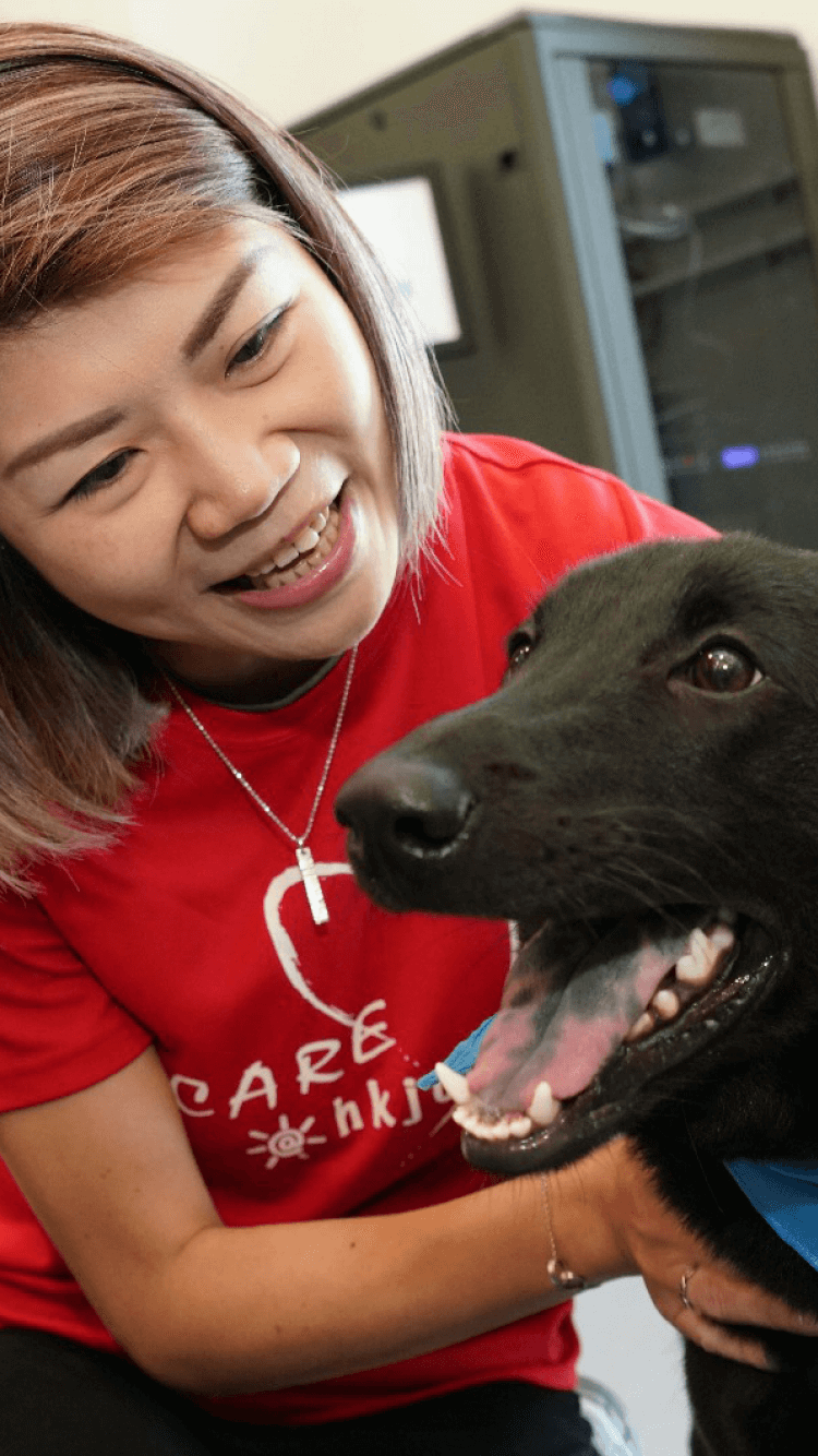 SPCA volunteer with happy dog