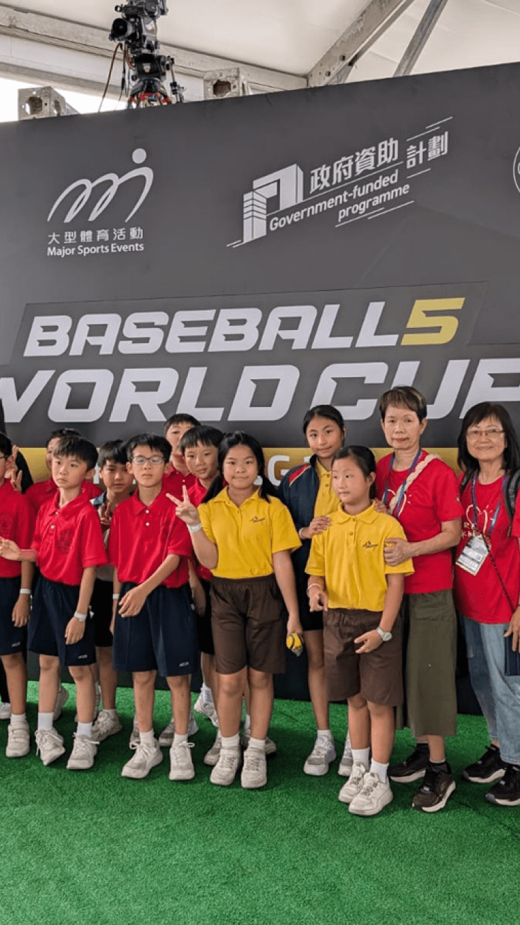 wbsc baseball children group photo in front of board