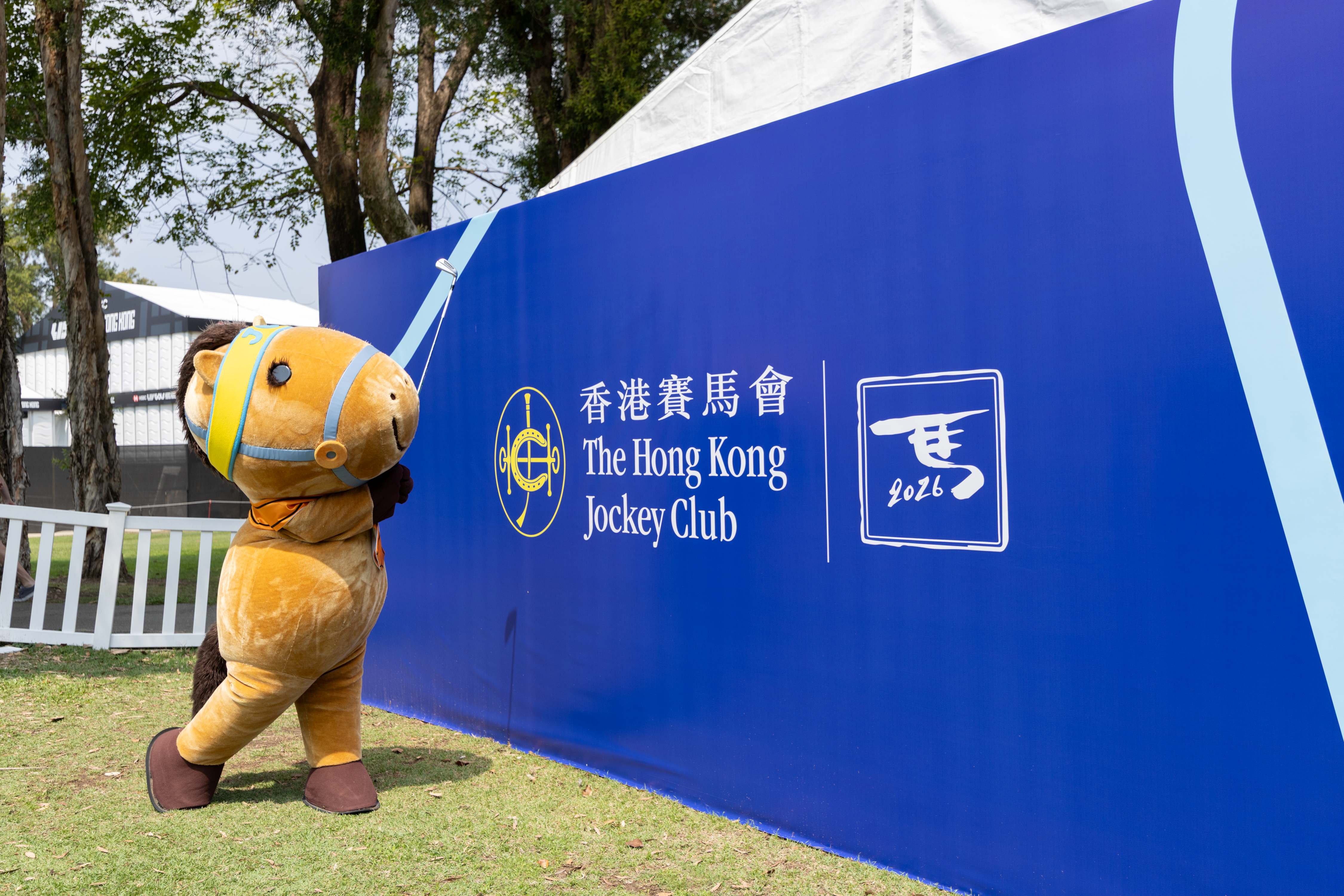 The Hong Kong Jockey Club mascot Captain JC swings a golf club at the LIV Golf Hong Kong event.