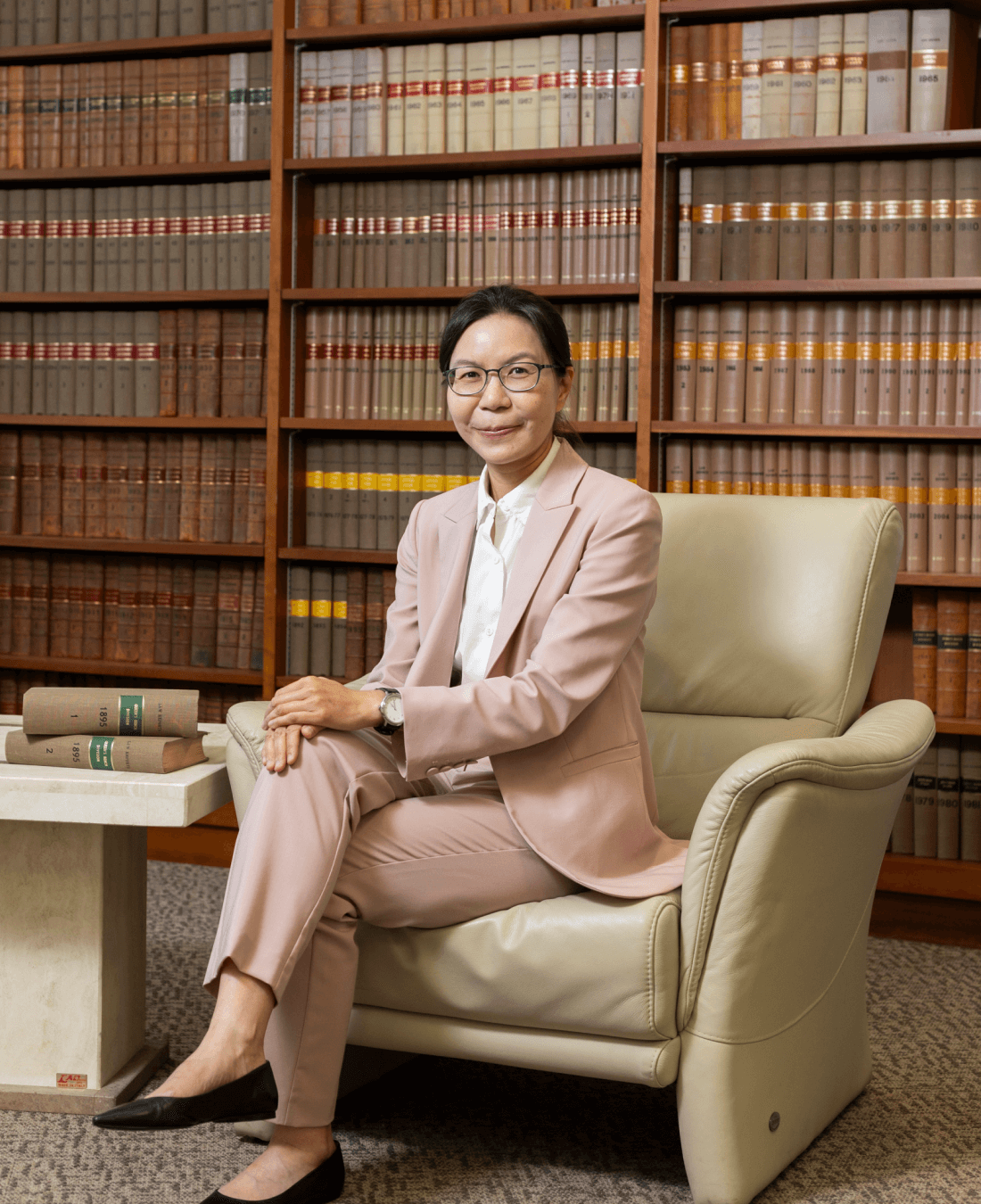 cora chan portrait in front of book shelf