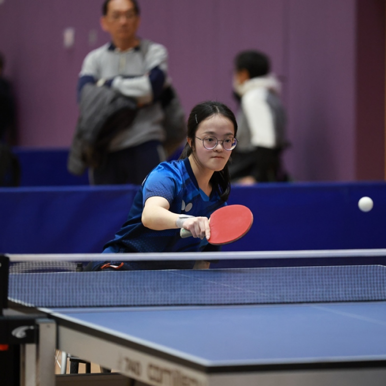 Athlete Yuen Wing-ki stays focused in a table tennis contest.