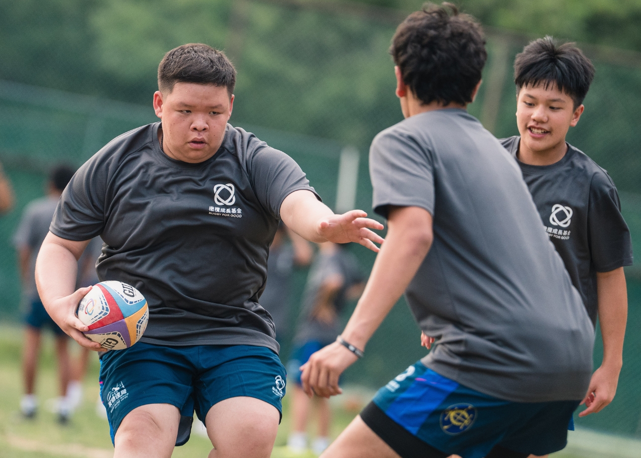 Passing the ball together on the pitch, and breaking through barriers in life