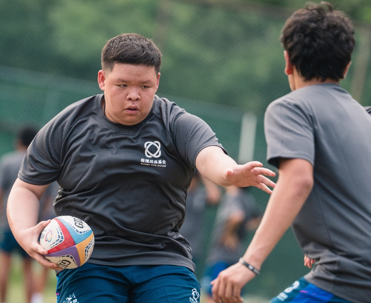 Passing the ball together on the pitch, and breaking through barriers in life