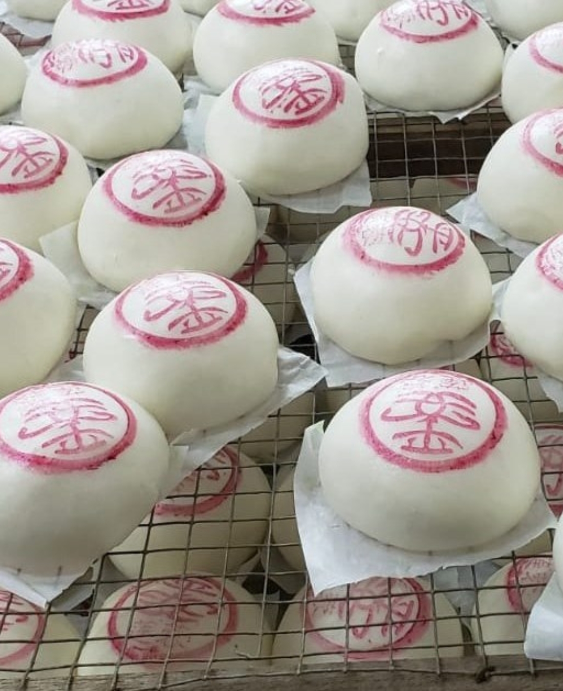 A peace bun stamped with a bright red "ping on" seal is a symbol of blessing and protection during the Cheung Chau Jiao Festival.